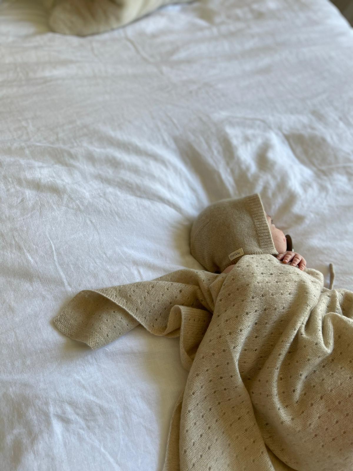 NEWBORN Premium Collection This is our most premium blanket, and if your looking for a special gift for a baby shower, this stunning unisex blanket should be top of your list. Incredibly soft and lightweight, made from 100% cashmere. This lovely hollow out design blanket is something to treasure and pass down the family in years to come. Comes in a white gift box 100% Cashmere designer cashmere baby blanket